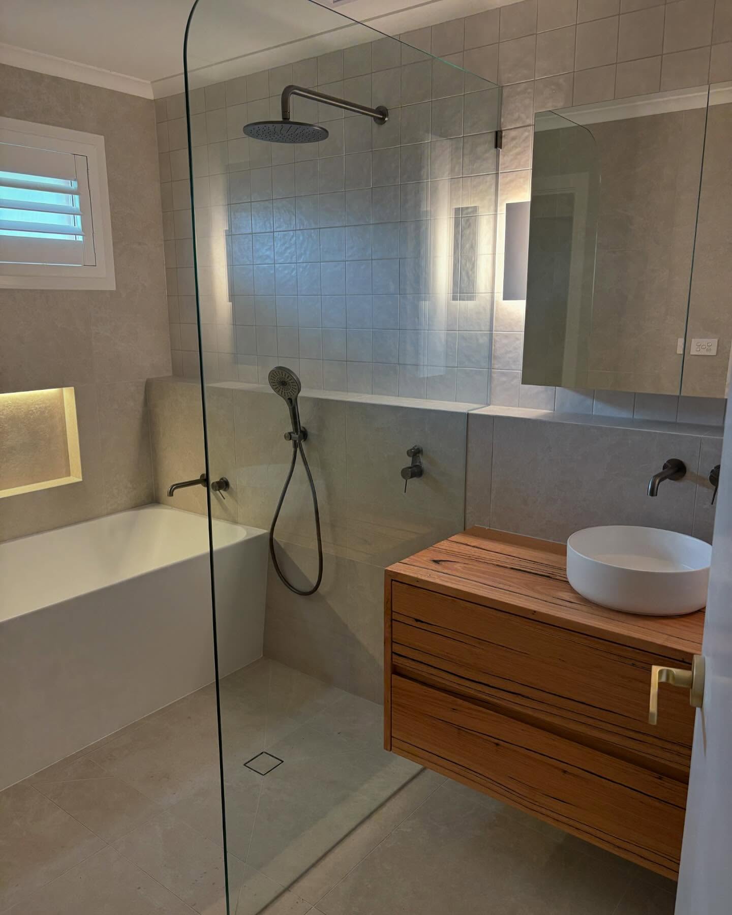 Brushed gold frameless showers 2