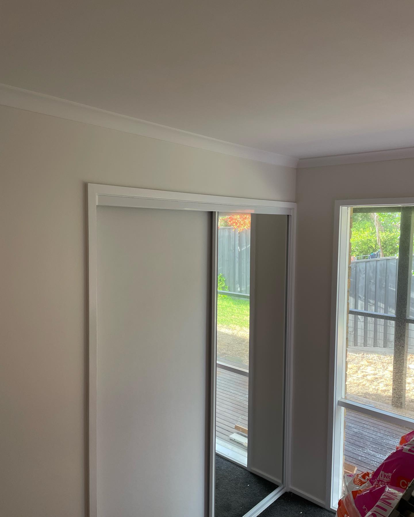 Framed robe doors in vinyl and mirror with white frame 2